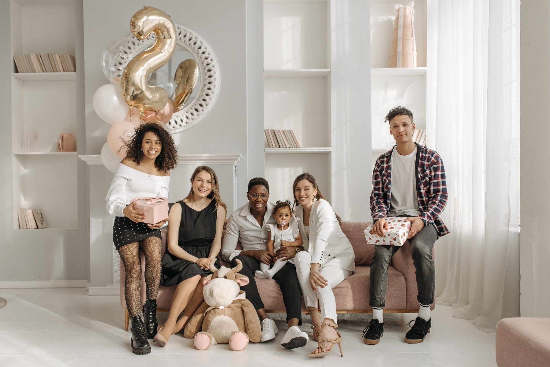 A picture of a family celebrating a special occasion with personalized gifts, illustrating how these presents enhance the gift-giving experience.